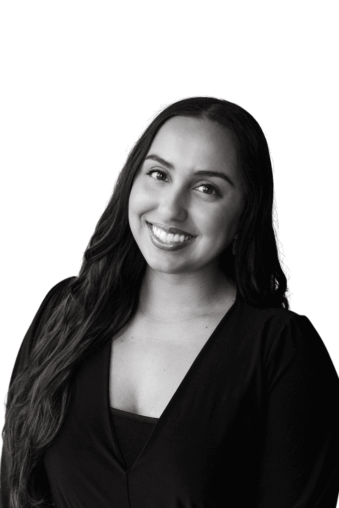 Smiling woman representing BlueWave Resource Partners in professional setting.