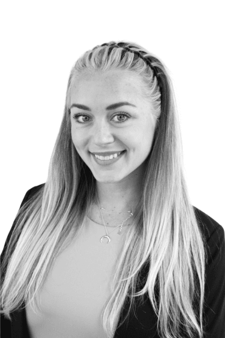 Professional woman with long blonde hair smiling for the camera.
