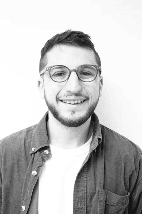 Portrait of Ross Bernstein, smiling man with glasses, in professional setting.