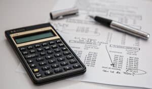Calculator and financial documents for business analysis.