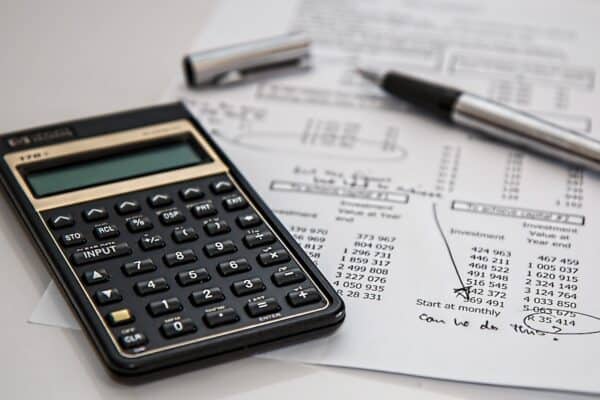 Calculator and financial documents for business analysis.