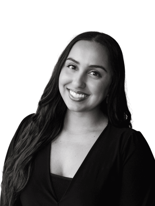Smiling woman representing BlueWave Resource Partners in professional setting.