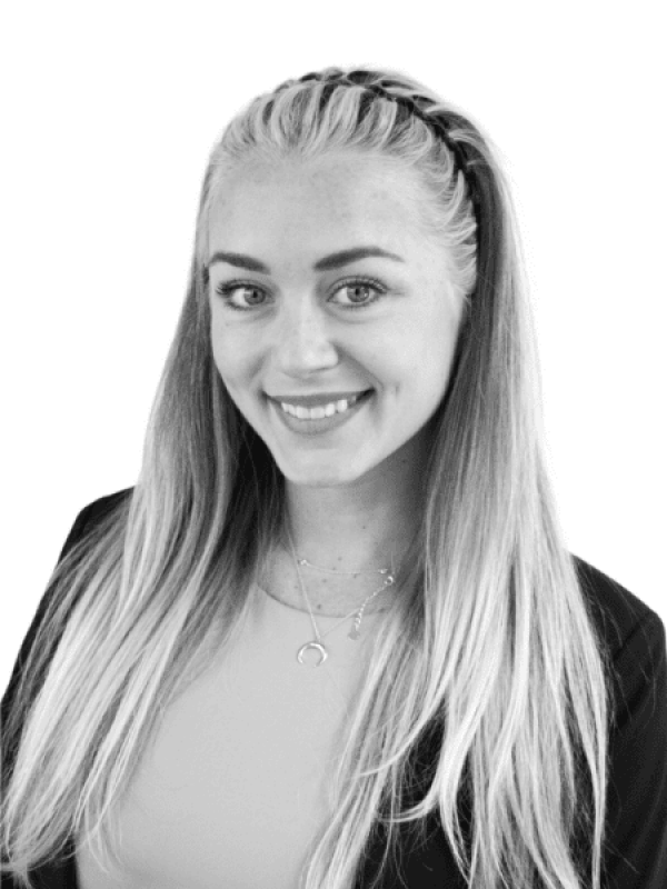 Professional woman with long blonde hair smiling for the camera.