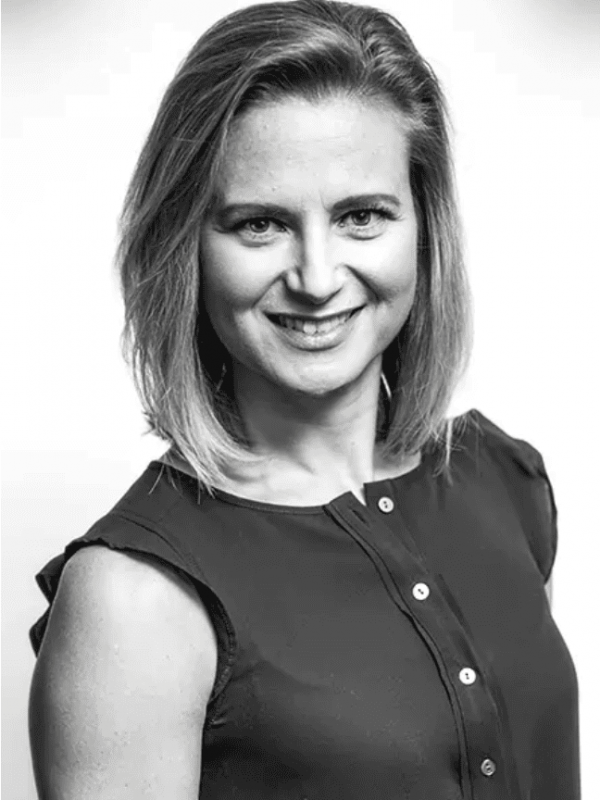 Professional woman smiling, representing BlueWave Resource Partners.