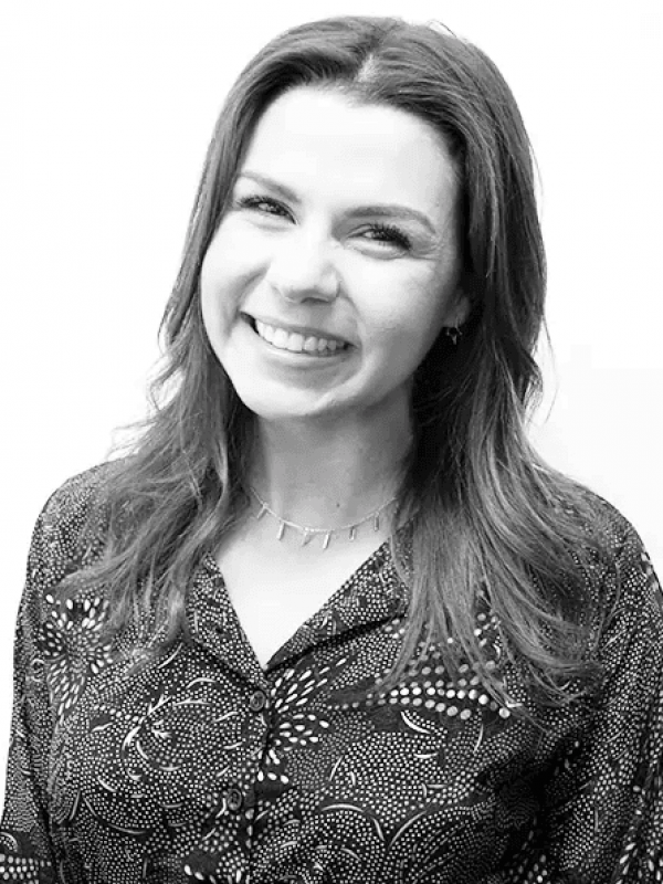 Smiling woman representing BlueWave Resource Partners in professional portrait.